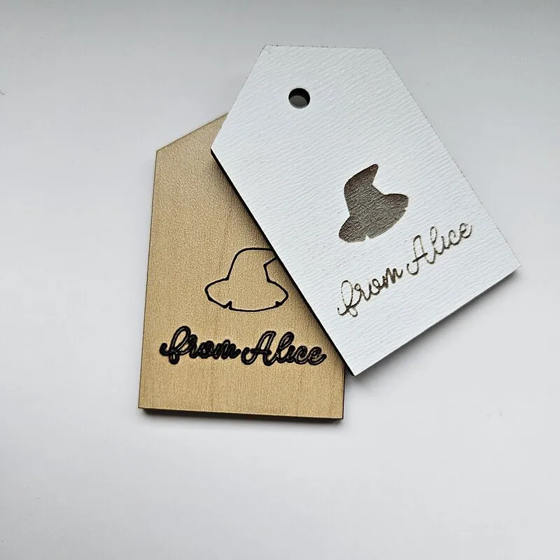 Laser-cut gift tag in a traditional tag shape, crafted from durable plywood.